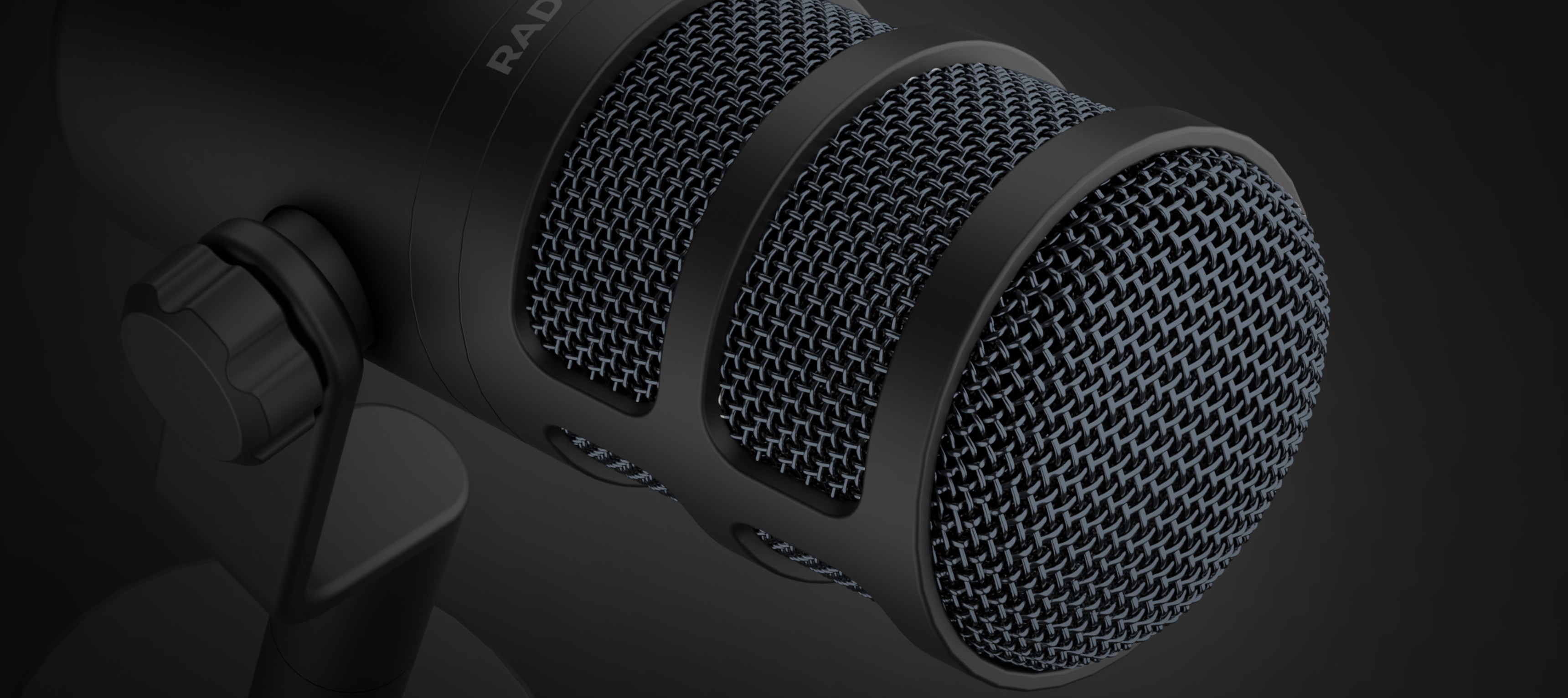 Nahaufnahme des dynamischen USB-Mikrofons Genesis Radium 350D mit schwarzem Finish und strukturiertem Mesh-Gitter
