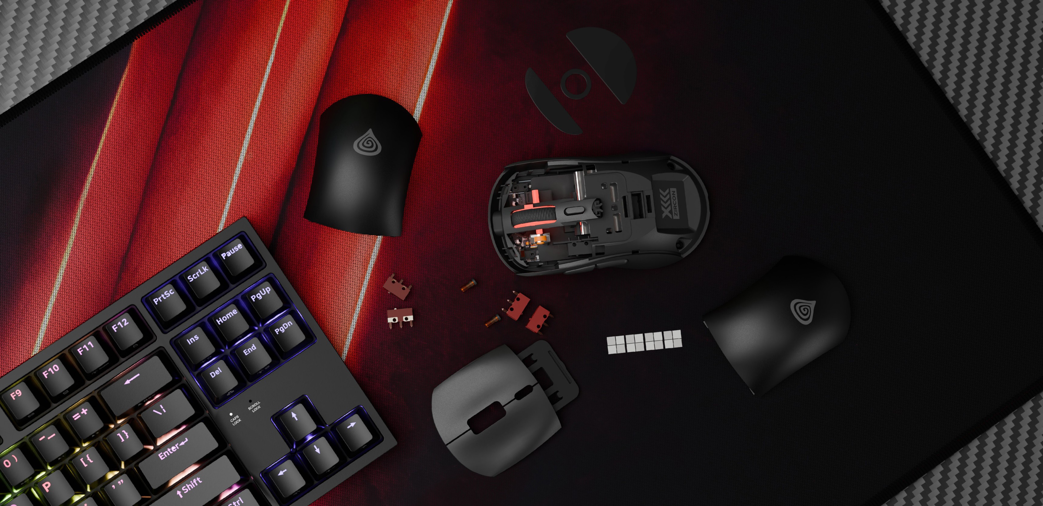 Kabellose Gaming-Maus Genesis Zircon XIII in Schwarz, mit abnehmbaren Abdeckungen und Komponenten auf einem texturierten Mauspad neben einer Tastatur