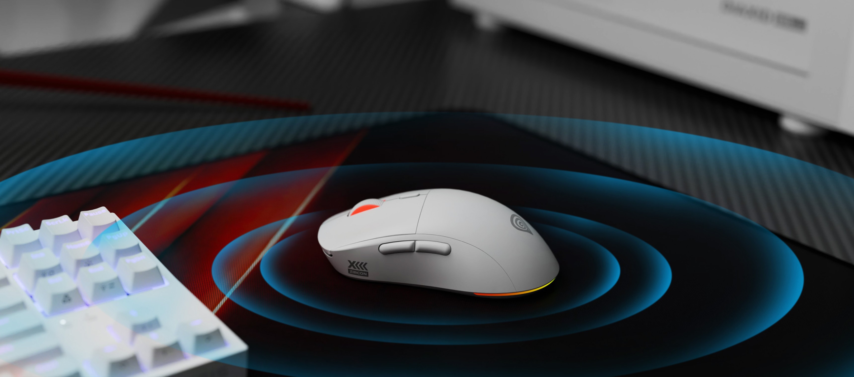 Kabellose Gaming-Maus Genesis Zircon XIII mit anpassbaren Funktionen und 26000 DPI, platziert auf einem Gaming-Mauspad