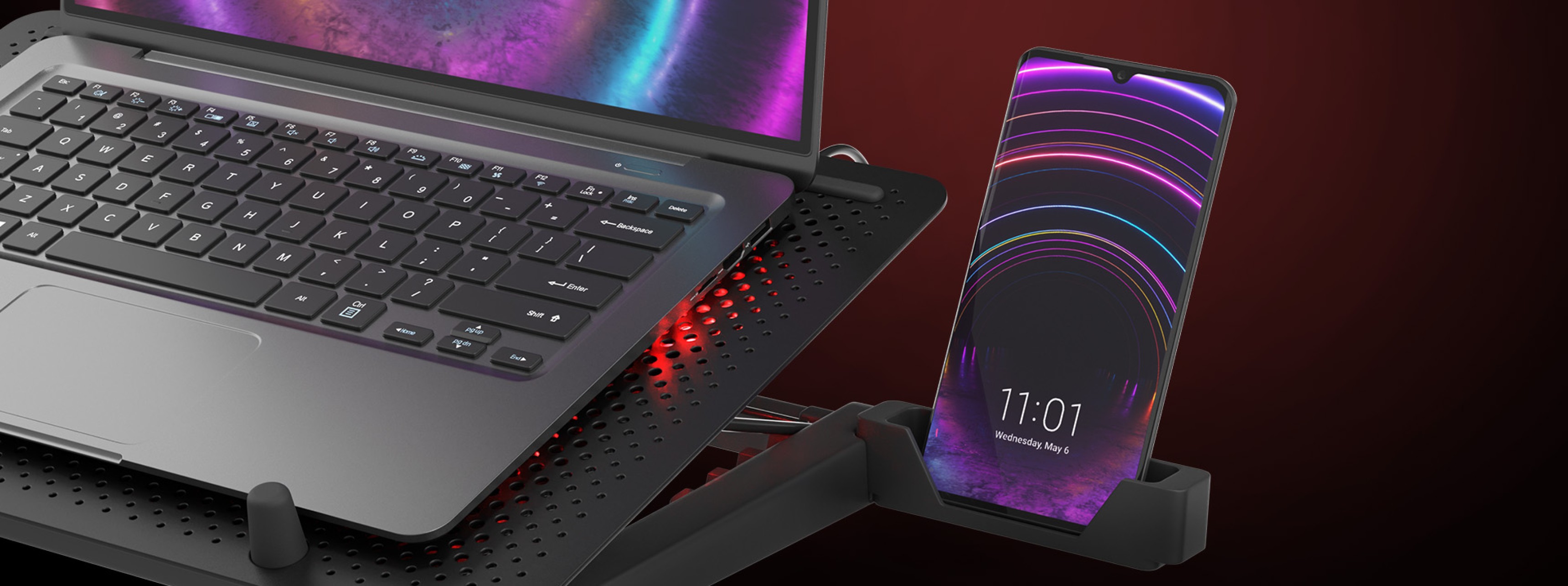 Laptop-Kühlmatte mit fünf Lüftern, entwickelt für 15,6-17,3" Laptops. Verfügt über RGB-Beleuchtung und einen USB-Anschluss sowie einen Telefonhalter